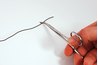 A hemostat clamp is used to stop a vessel from bleeding.