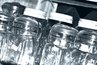 Canning jars help preserve cayenne peppers.