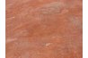 Iron oxide, when present in soil, can give it a reddish hue.