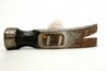 Metal wedges help to secure the wooden handle to the head.