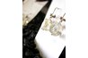 Earrings are subject to crushing or bruising if left hanging on an earring card during transport.