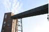 Some configurations transport materials to elevated equipment.