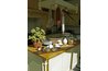 Use colorful kitchen accessories to draw attention away from dated appliances.