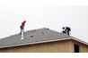 Nail down shingles to protect that patio roof