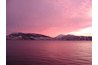 The water captures the colors of the sky.
