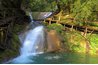 Beam bridge over a waterfall