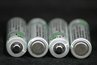 Batteries with alternating terminals. The first and third batteries show a positive terminal.