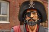 A bicorn hat with the jolly roger on the front of the pressed-up brim.