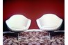 Reproduction egg chairs provide psychedelic styling elements via shape and material.