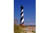 Many lighthouses are painted white or decorated with a wide horizontal band of color, but some get more interesting.