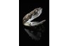 Cultured pearl on black background defines iridescent finish.