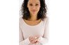 Woman holding pills