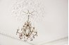 Thousands of iridescent lights finish chandeliers and other fixtures.