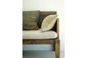 A thick bench cushion works well as a headboard.