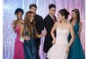 Formal dresses and tuxedos complete the festivities.