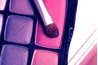 Eye, cheek and face makeup with a shiny finish contains iridescent minerals