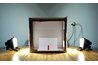 Cut out the sides of a box and replace them with white translucent material to make a soft box.