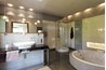 This modern approach to bathroom lighting meets installation code.