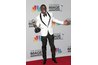 Actor Lance Gross poses in a white dinner jacket.