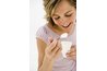Woman eating yogurt