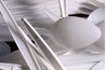 A spoon removes chocolate substance without ripping your comforter.