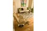 Connect modern and psychedelic elements such as wild rugs, drum lampshades and sleek pottery.