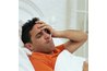 Sick man in bed