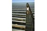 Woman walking up bleacher steps