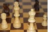 Set up a chessboard for a one-on-one activity.