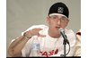 Eminem wears a baseball cap honoring a contemporary hip-hop artist, 50 Cent.