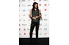Actor Russell Brand adds several other accessories to his ripped-up skinny jeans and skinny belt.