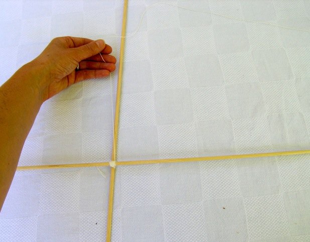 Run string around dowels to make the frame.