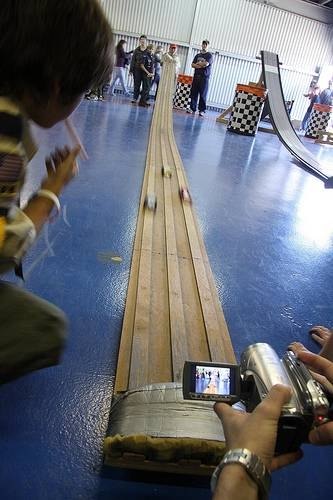 Pinewood derby race track with three lanes.
