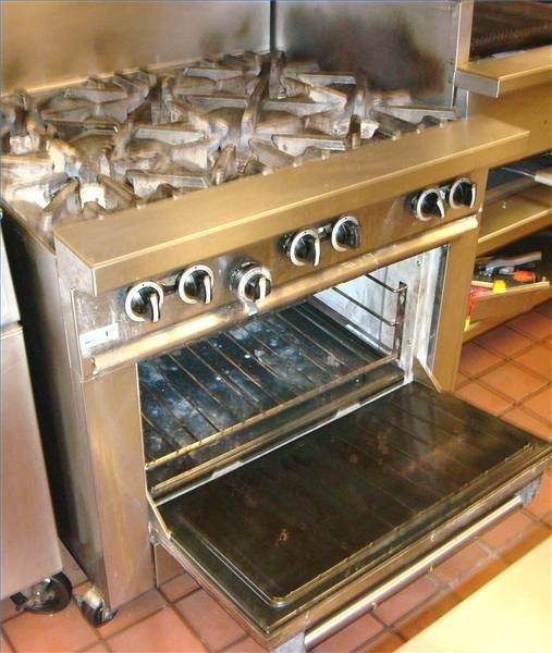 Cooktop unit with six-burner range and standard oven below