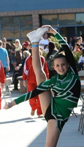 This cheerleader is ready to take her bow airborne.