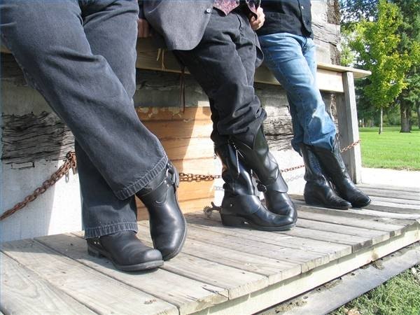 A group of well worn cowboy boots A group of well worn cowboy boots