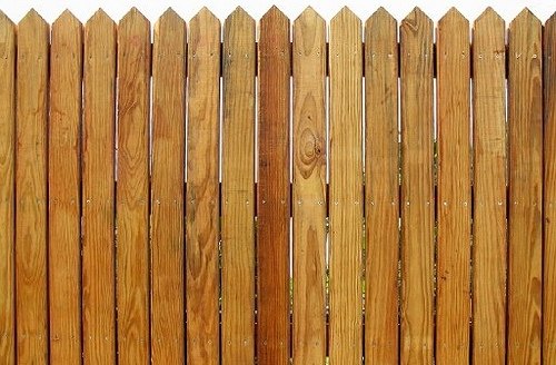 This cedar stockade style fence uses standard grade pickets.