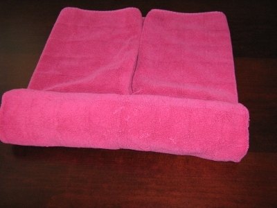 Roll the sides toward the center (both).