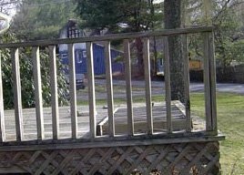 A simple, standard deck railing made from inexpensive wood pickets