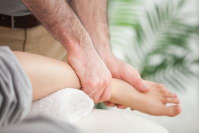 doctor showing ankle movement exercises