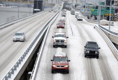 Commuters on snow-covered highway in Pittsburgh