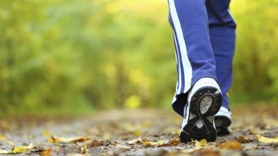 Woman walking on a trail in autumn