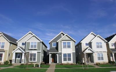 Rows of houses with gray roofs.