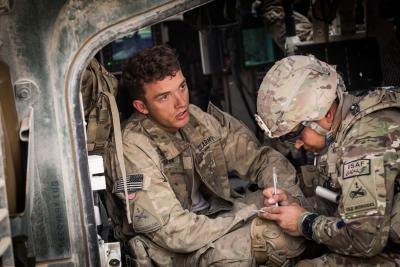 Military medic tends to a soldier.