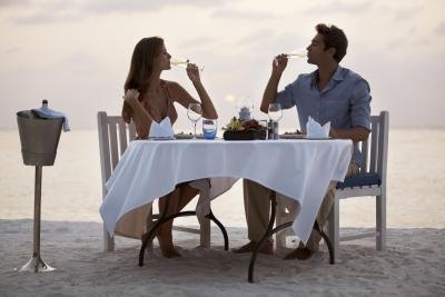 Couple having dinner on beach