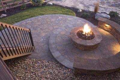 A stone bench and or fire pit can bring your pebble garden to life.
