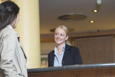 Woman checking in to hotel