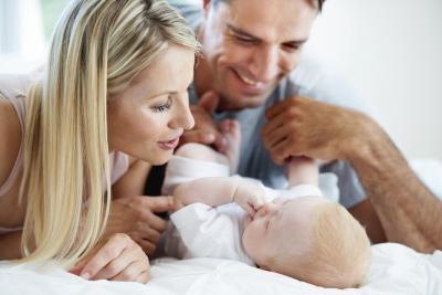 couple looking at baby couple looking at baby