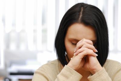 Young woman with a headache.
