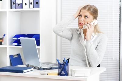 Stressed woman on phone.